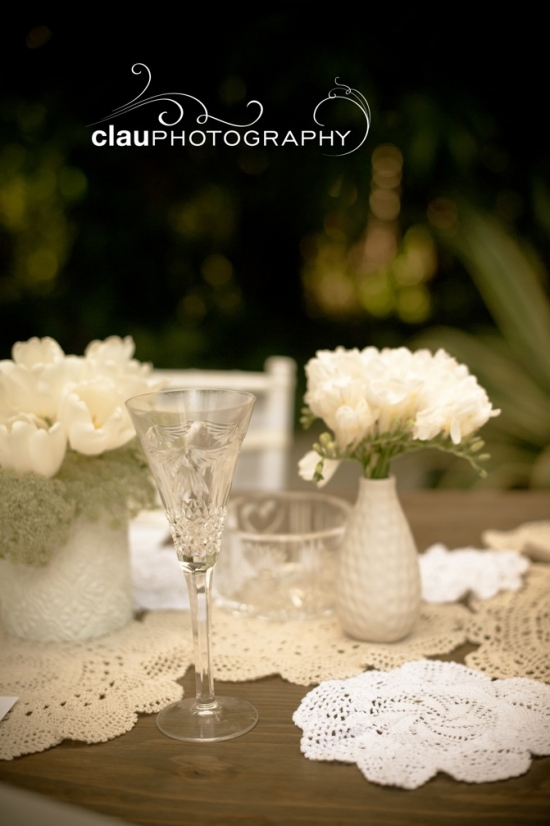 Wedding table setting with flowers and doilies
