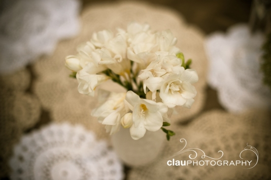 Elegant white freesia bouquet on lace doilies
