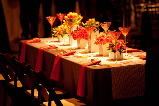 Elegantly set table with flowers and cocktail glasses