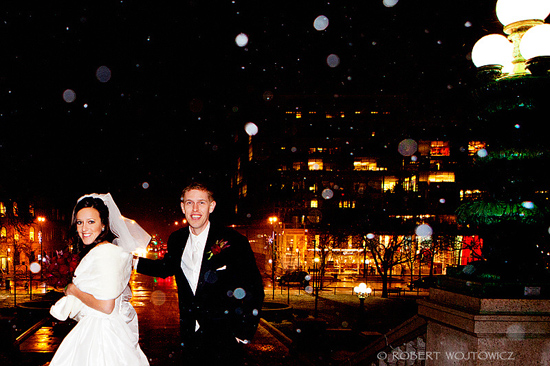 Happy couple's snowy night wedding photo