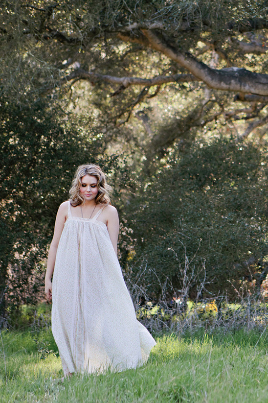 Woman in cream dress in park