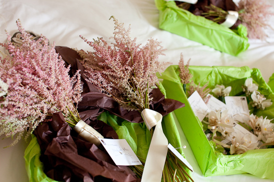 Wedding bouquets of astilbe and orchids in gift wrap