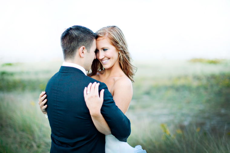 Bride and groom embrace lovingly on their wedding day