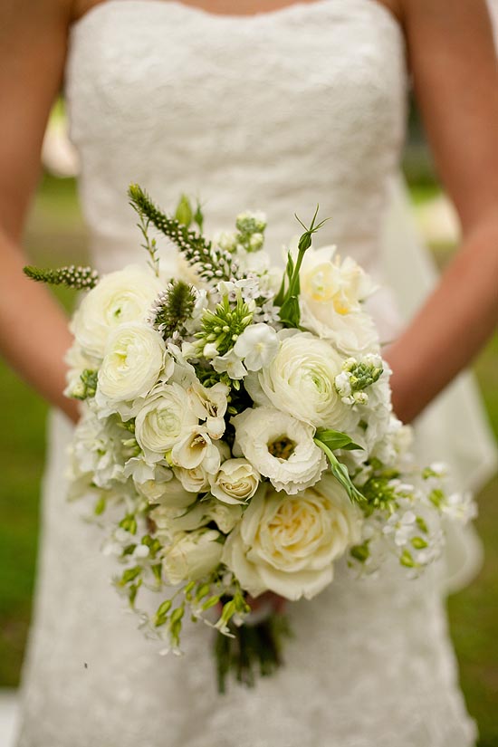 Elegant white bridal bouquet of roses and lilies