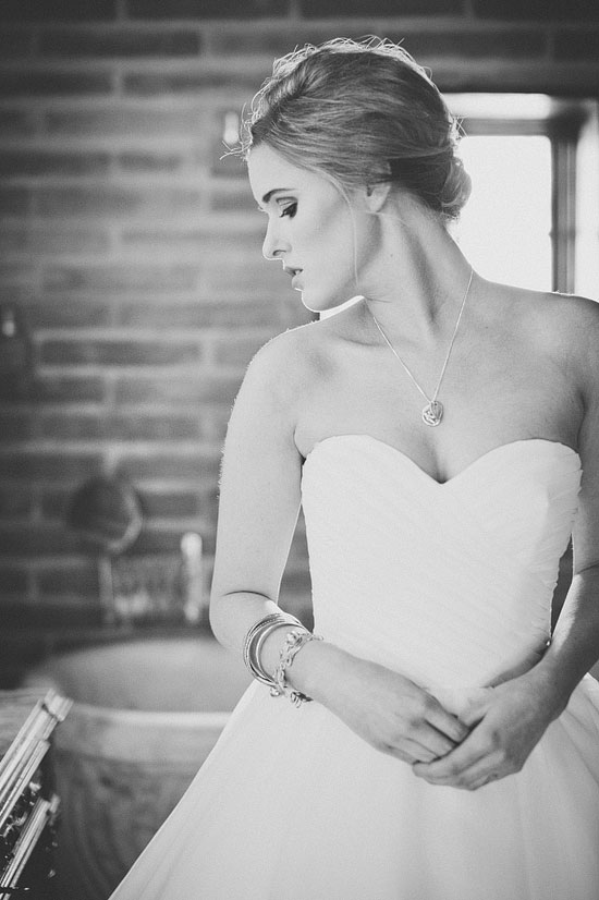 Black and white portrait of pensive bride in wedding dress