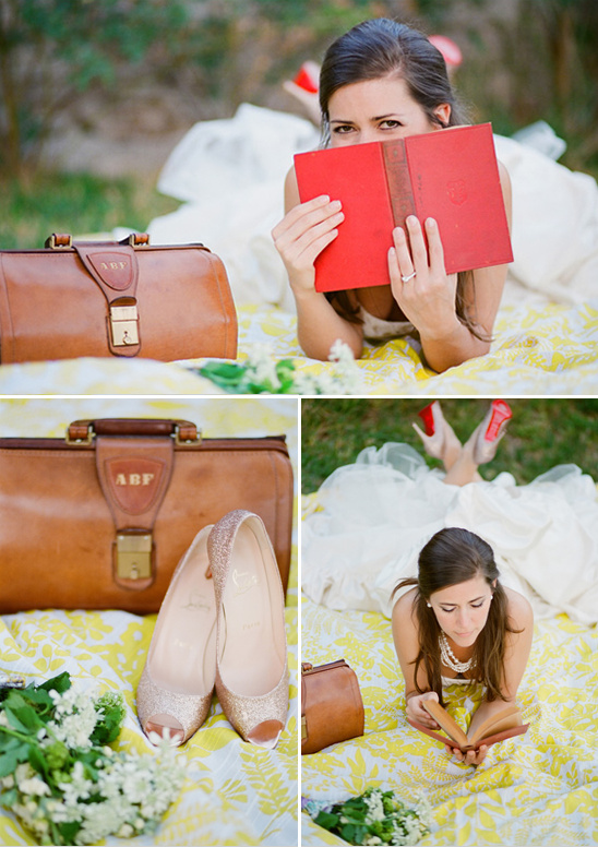Bride reading with vintage bag and gold shoes on blanket
