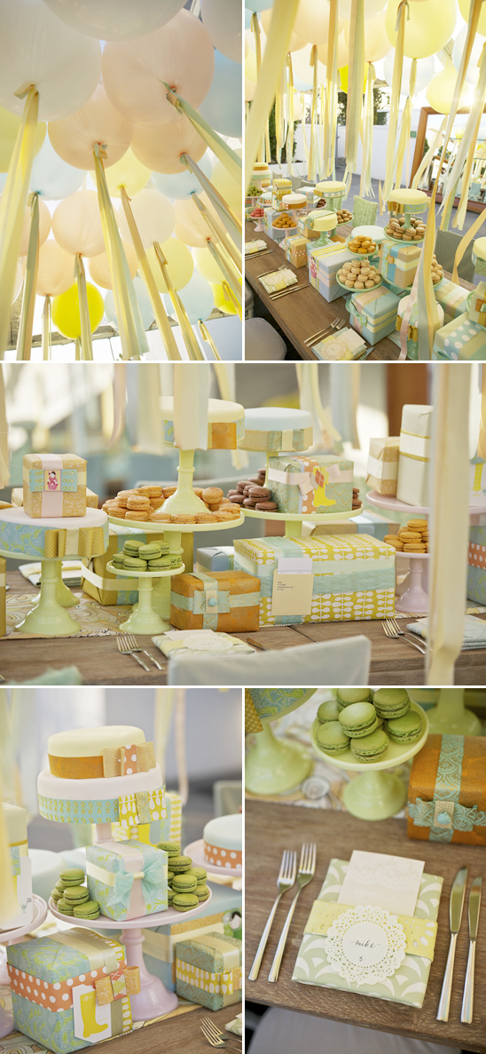 Pastel-themed baby shower dessert table with gifts
