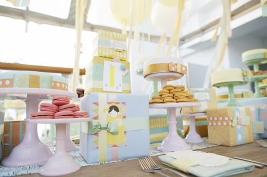 Pastel birthday treats: cakes, macarons, and gifts