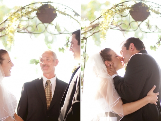 Happy couple kissing at outdoor wedding ceremony