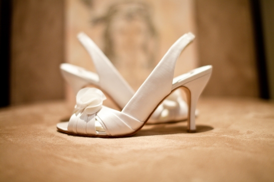 Elegant white bridal heels with flower detail