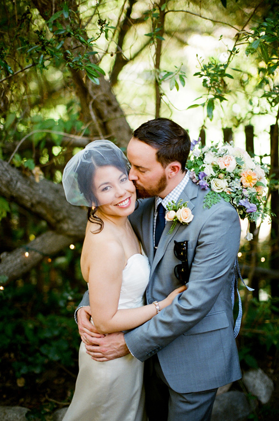 Happy bride and groom embracing at wedding