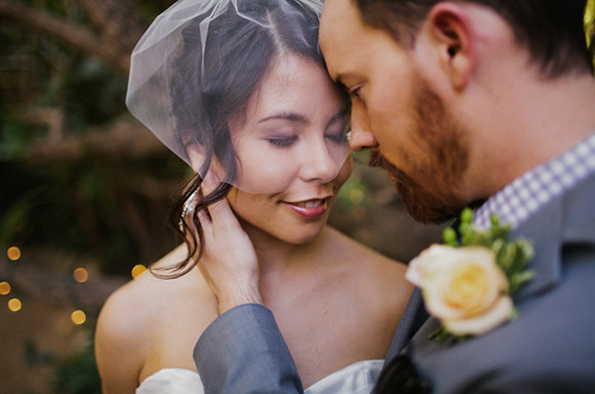 Bride and groom gaze lovingly on their wedding day
