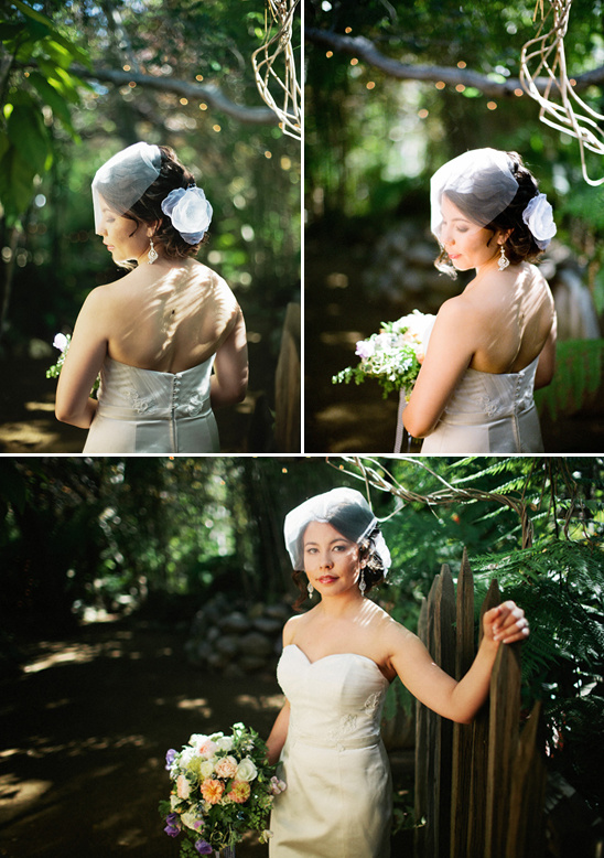 Bride with veil and bouquet in garden wedding photos