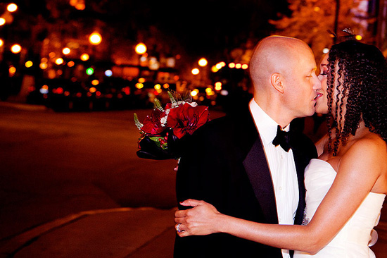 Couple kissing at night wedding