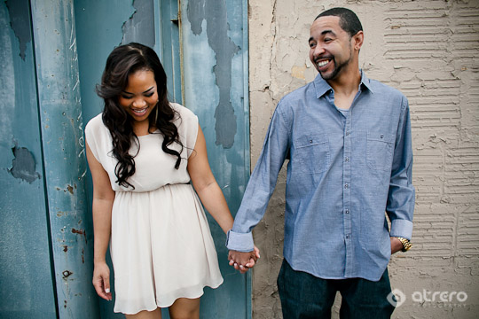 Smiling couple holding hands, happiness and love displayed together