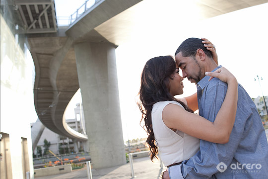 Romantic couple embracing under a bridge in love and affection