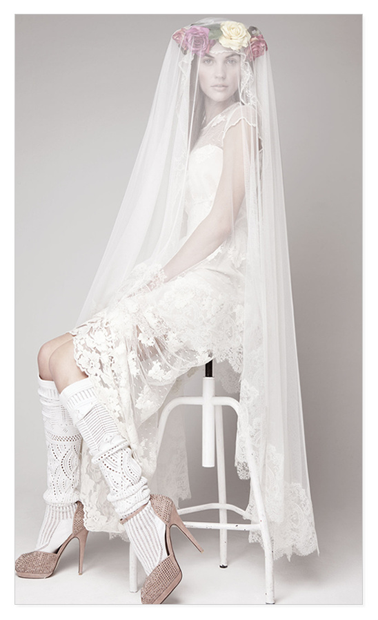 Bride in lace wedding dress and long veil