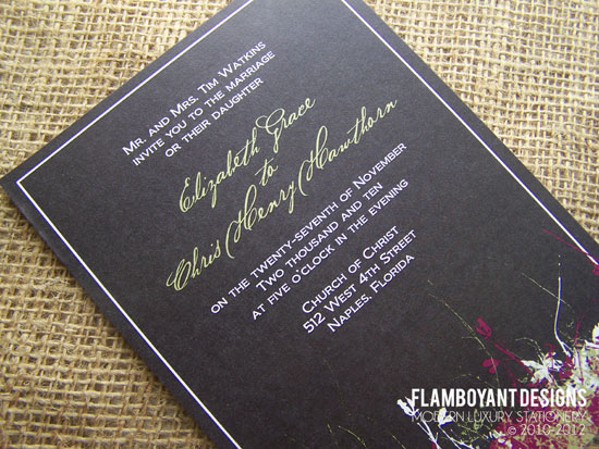 Elegant black wedding invitation with gold calligraphy