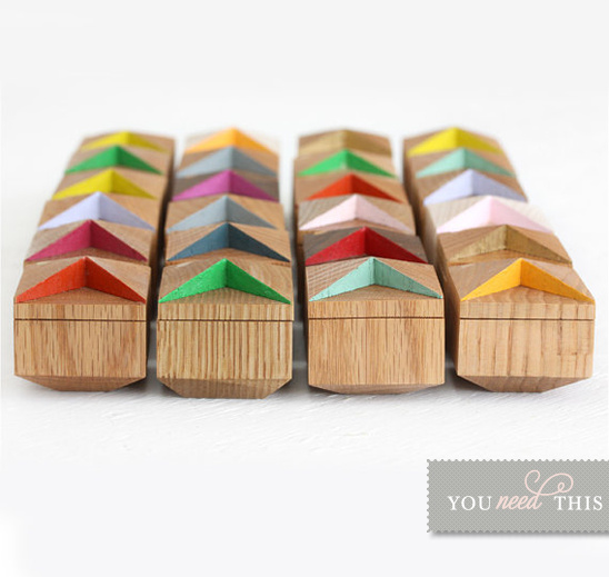 Colorful wooden boxes with unique geometric roof design
