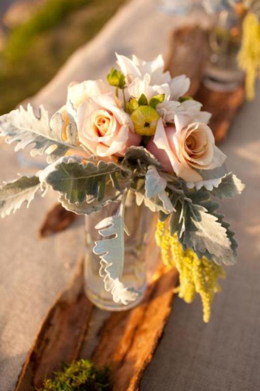 Rustic wedding centerpiece: roses in glass vase