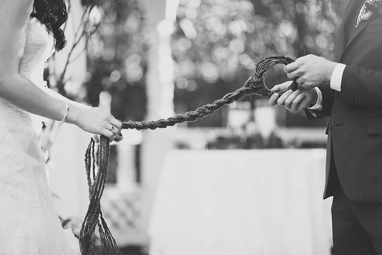 Bride and groom perform unity braiding wedding ritual