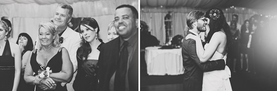 Black and white wedding guests watching bride and groom
