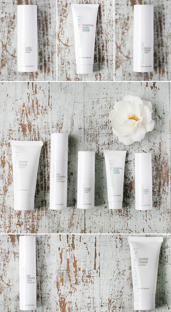 Collection of beauty skincare products artfully arranged with flower