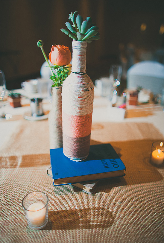 Elegant wedding centerpiece twine wrapped bottle succulent
