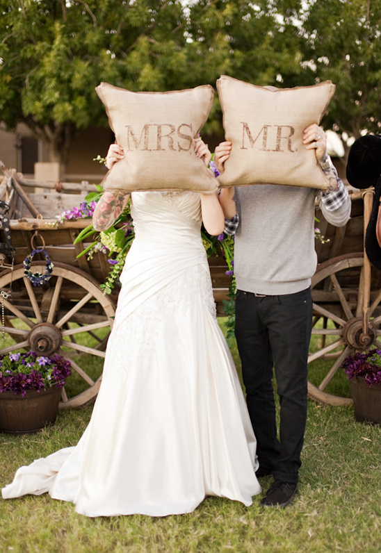 Happy couple holding pillows, wedding