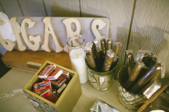 Cigars, matches, and candles set up for a relaxing event