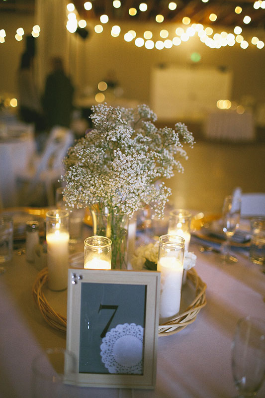 Wedding table setting with candles and floral centerpiece