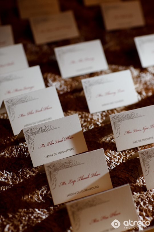 Elegant place cards on a golden textured surface, ready for a special event
