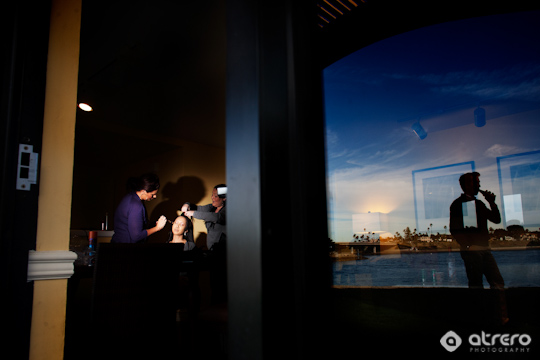 Bride getting ready with sunset reflection