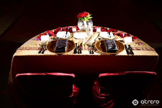 Romantic dinner table setting with flower decorations and roses