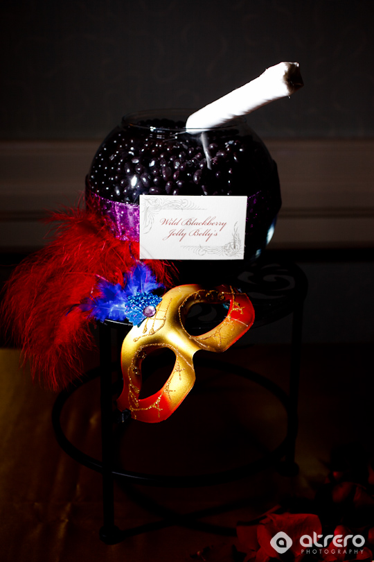 Fancy display with jelly beans, mask, and feathers for an event