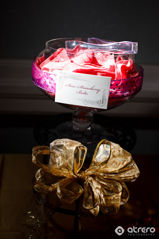 Delicious sour strawberry belts in a glass with golden bow