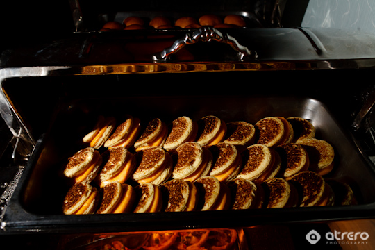 Freshly made cheese sandwiches in a stainless steel buffet