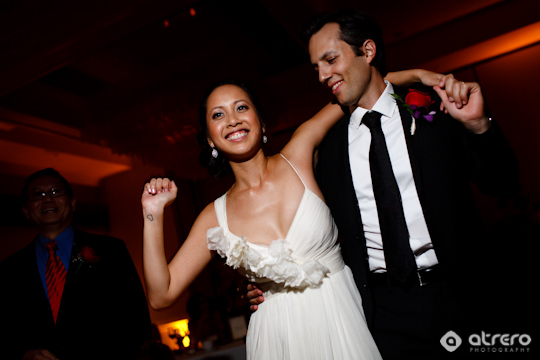 Bride and groom celebrate their wedding on the dance floor with joy
