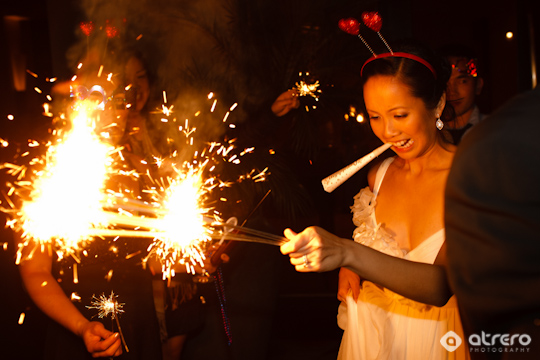 Party goers enjoy sparklers at a festive celebration