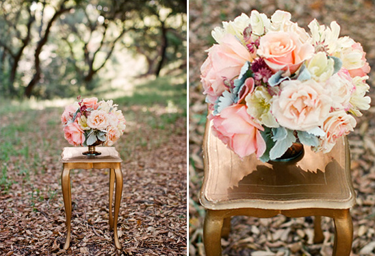 Pastel roses in gold vase on ornate table