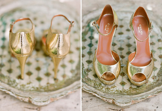 Elegant gold Gucci peep-toe heels on tray