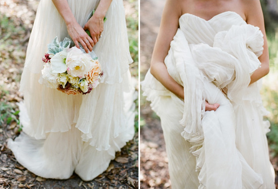 Bride holding elegant wedding bouquet and dress