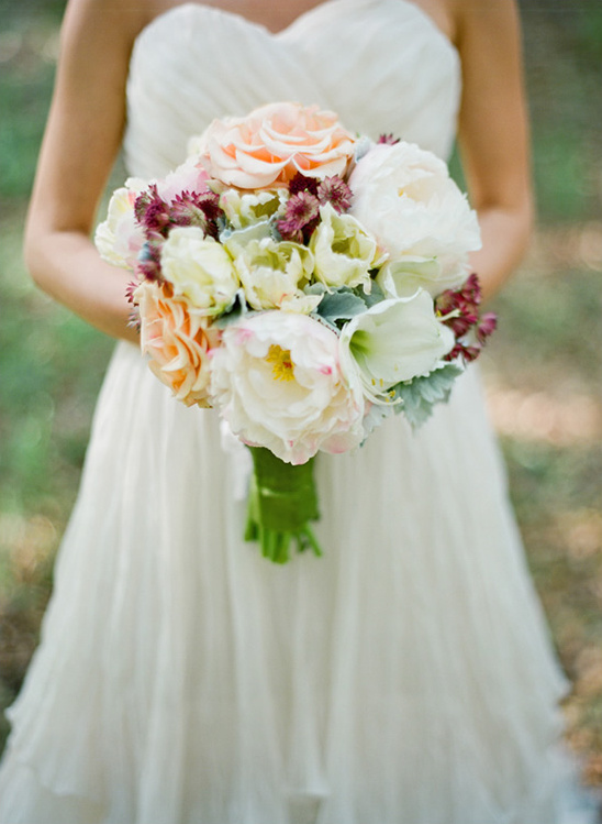 Bride holding beautiful pastel wedding bouquet
