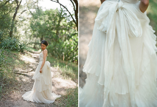 Bride in flowing ivory wedding gown outdoors