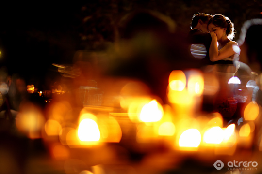 Romantic couple embrace under the soft glow of evening lights
