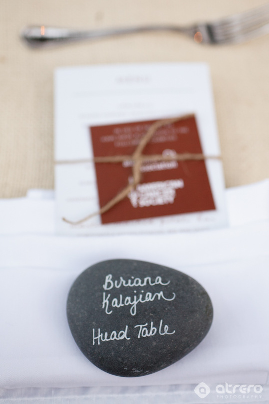 Handwritten rock place card for Buriana at head table