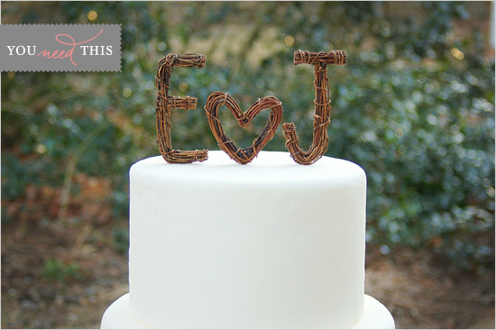 White wedding cake with rustic twig E heart J topper