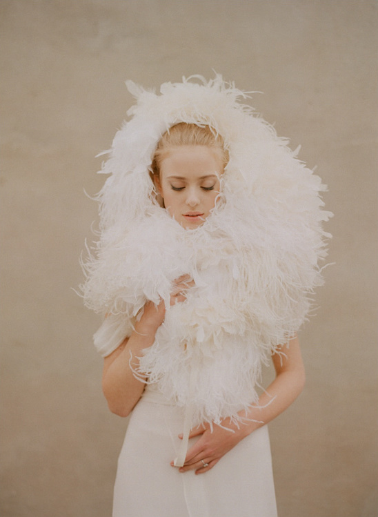 Bride in elegant white feather stole