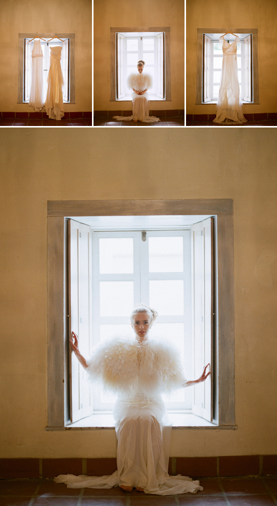 Bride in white gown, fluffy cape, window setting