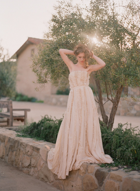 Woman in a peach wedding dress outdoors